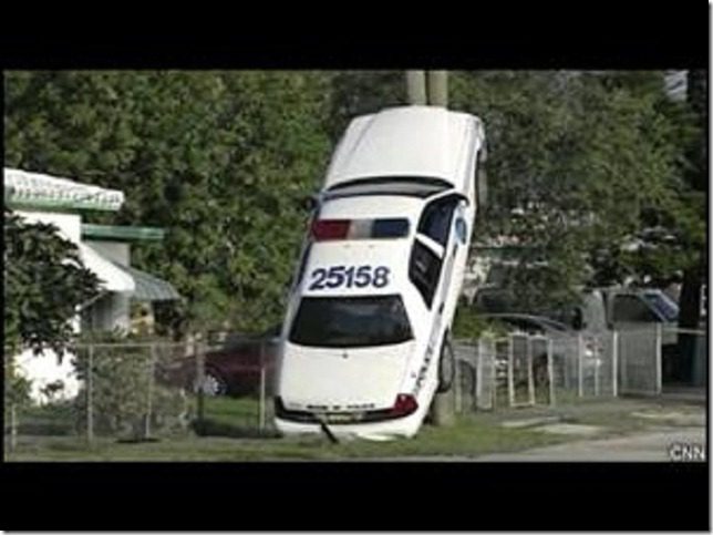 111214085401_police-car-up-a-pole