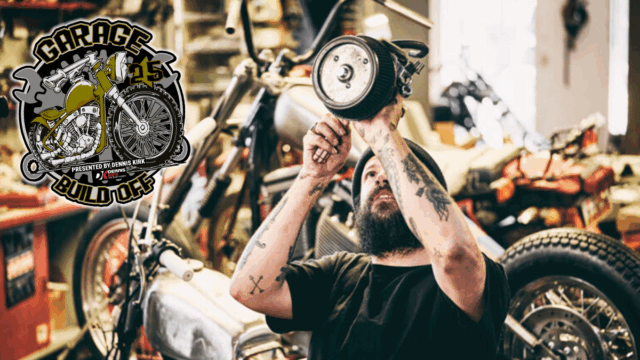 a man holding an air cleaner for a motorcycle