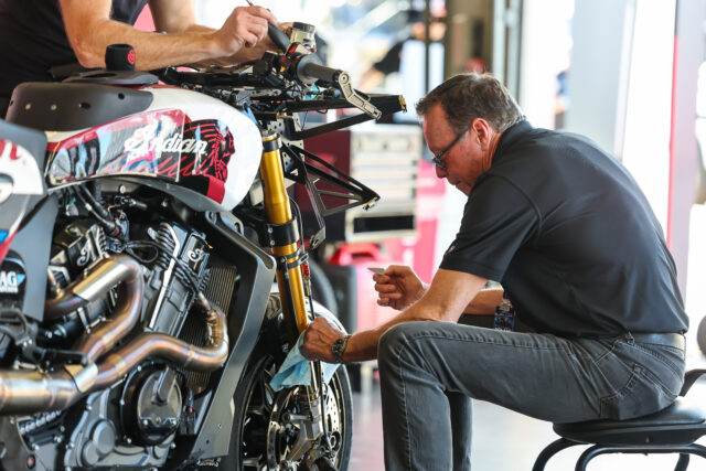 Mike Kennedy working on an Indian Motorcycle At King of The Baggers
